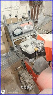 Ariens 11528LE Two Stage Gasoline Snow Blower 28in Orange Headlight